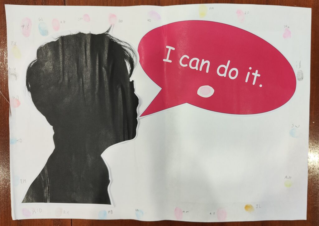 A piece of paper with a silhouette of a child and a speach bubble