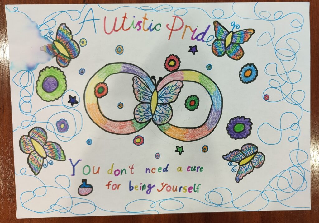 A piece of paper with a colorful child's drawing of butterflies and flowers