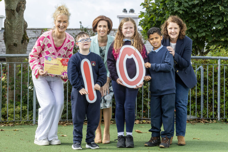 Minister Naughton and Dr. Aideen Hartney of the NDA with pupils from Claddagh National School.